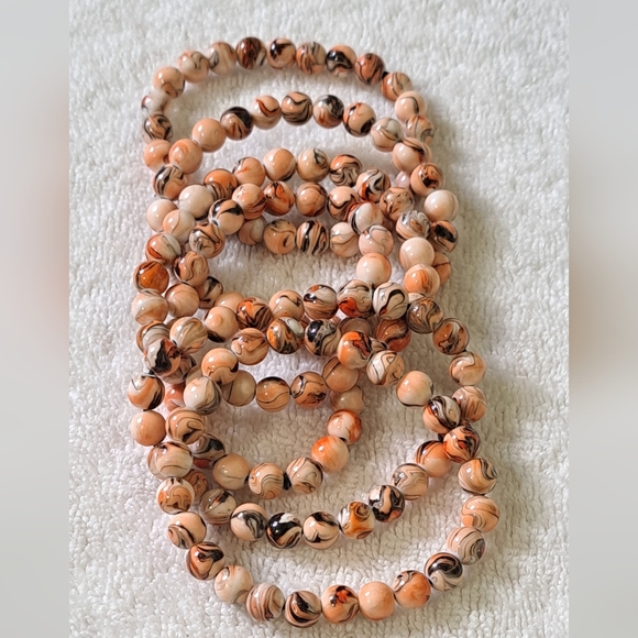 Unbranded Jewelry - Stretch bracelets ( set of 6 ) Tan Orange Beige and Black New without tags.